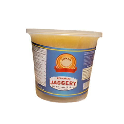 Container of jaggery with a label on a white background