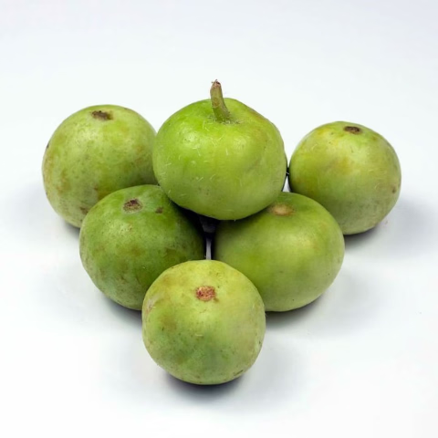 Five green, round fruits with small brown stem remnants, clustered together on a clean white background.