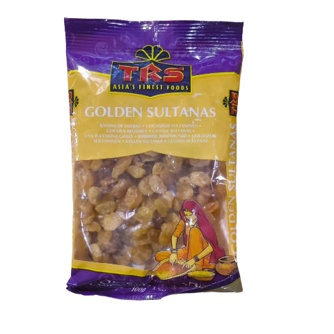 A bag of TKS Golden Sultanas, featuring a purple and yellow packaging design with an illustration of a woman preparing the sweets, placed on a light wood surface.